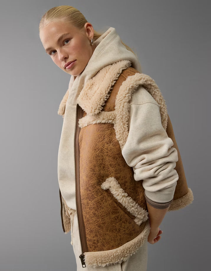 Women’s shearling leather vests with warm sleeveless aviator styling