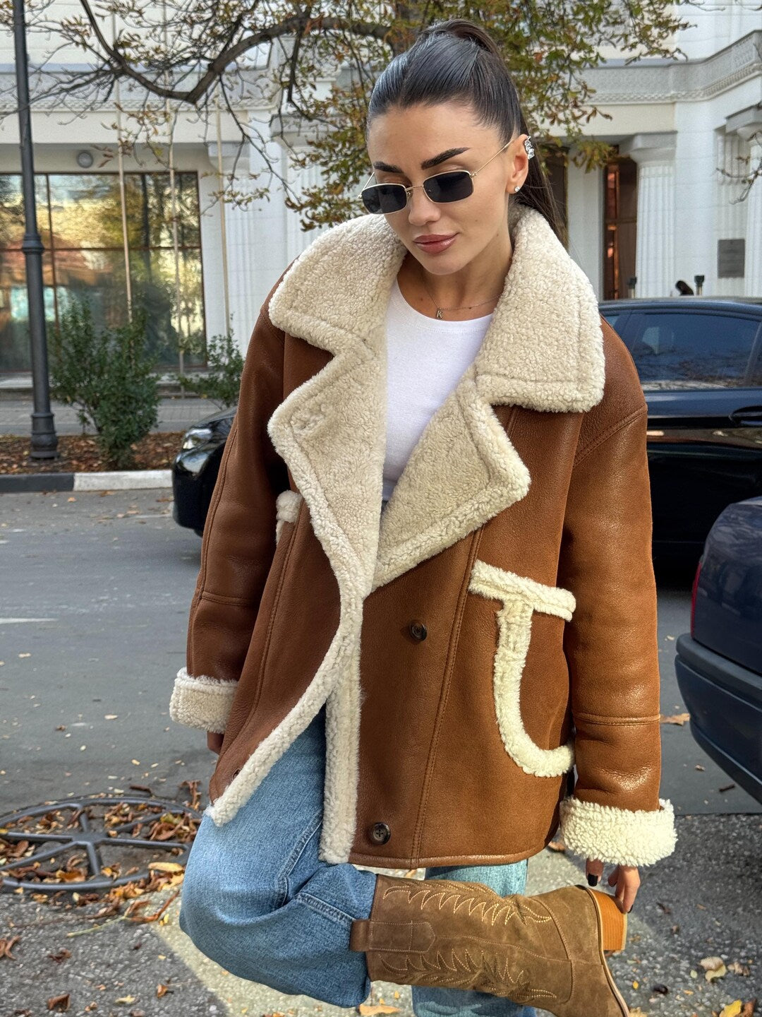 Women’s shearling coats in premium leather with warm shearling-style lining, longline design and elegant winter outerwear appeal.