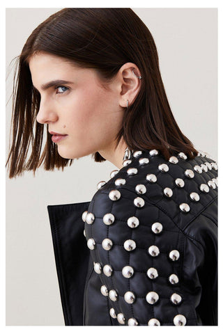 • silver spiked leather jacket detail close up
