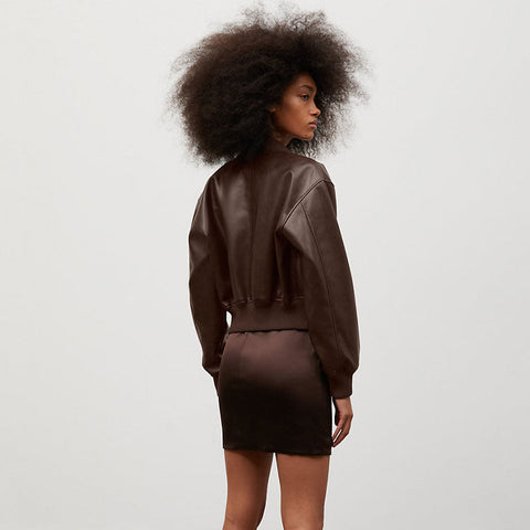 • womens flight jacket shearling interior close up
