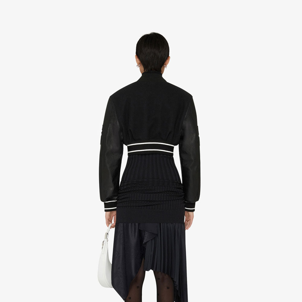 • black leather bomber jacket shearling lining close up
