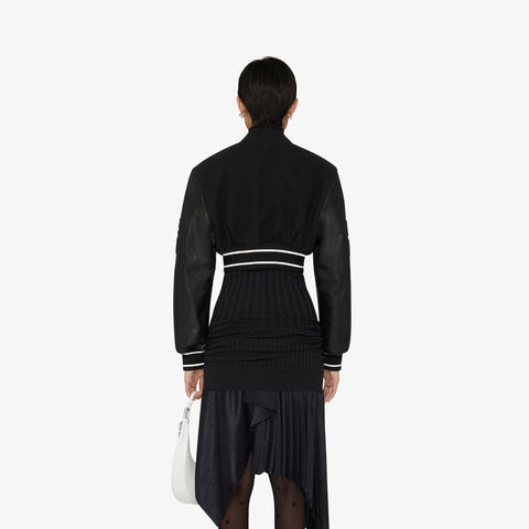 • black leather bomber jacket shearling lining close up
