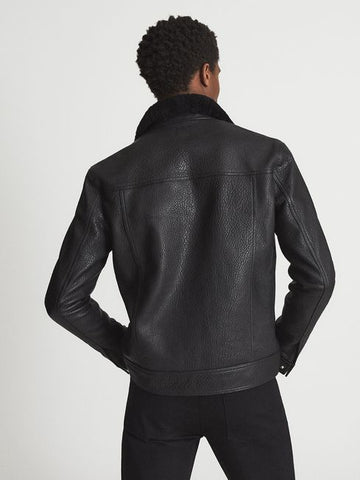 • mens leather jacket fur collar detail close up
