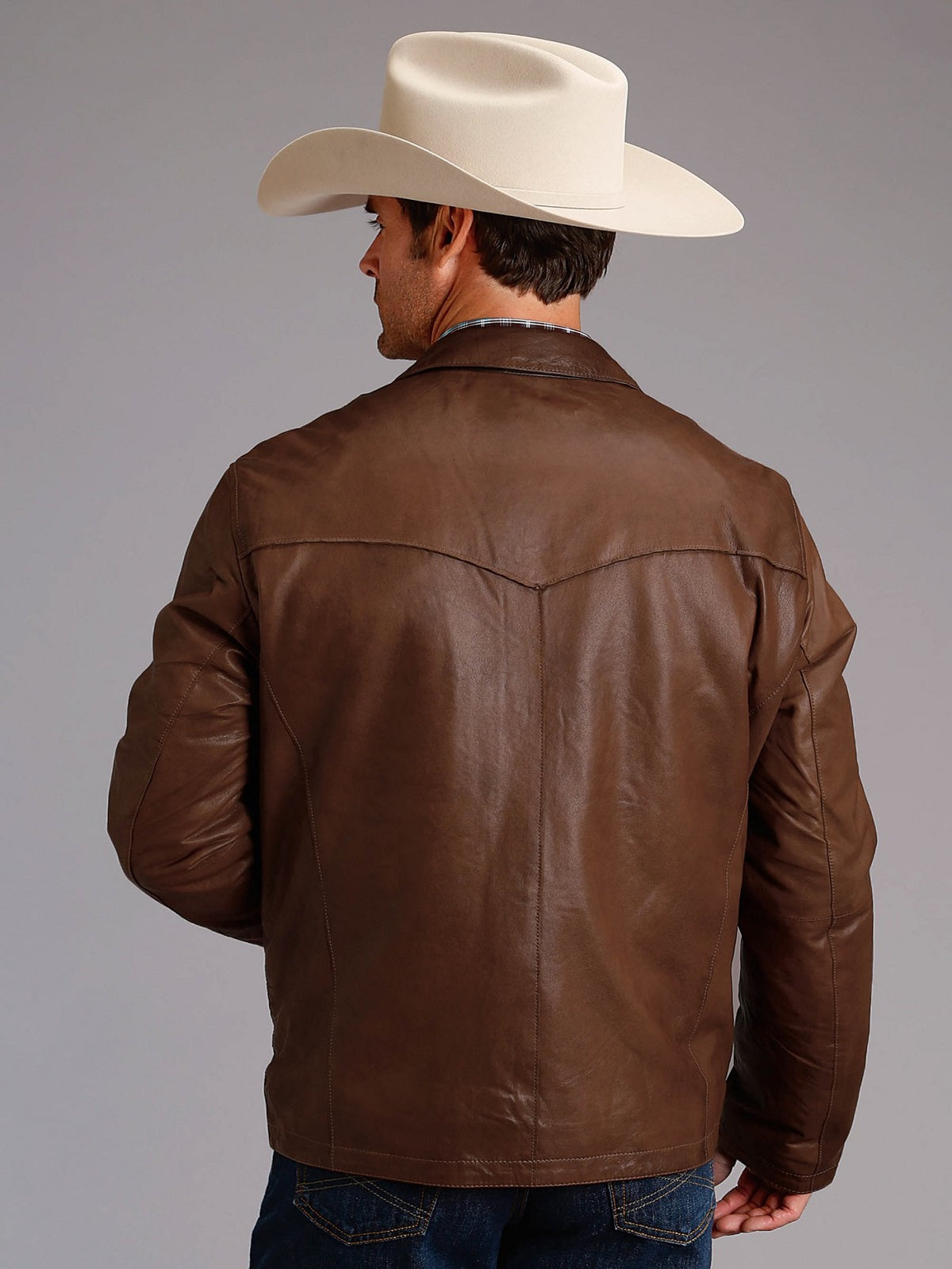 • brown leather jacket cuffs close up
